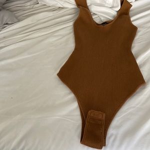 Brown body suit